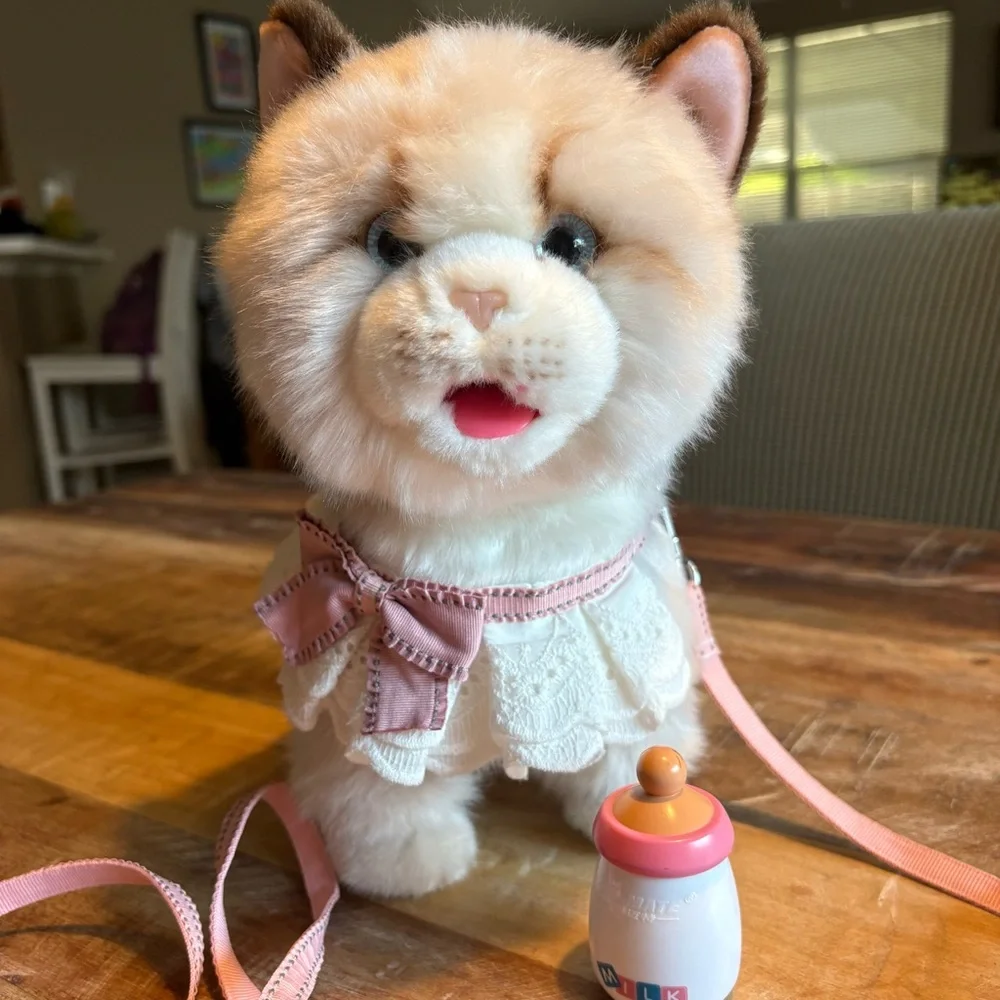 Battery powered Cat Toy that walks, miaus/talks, drinks milk and shakes tail.